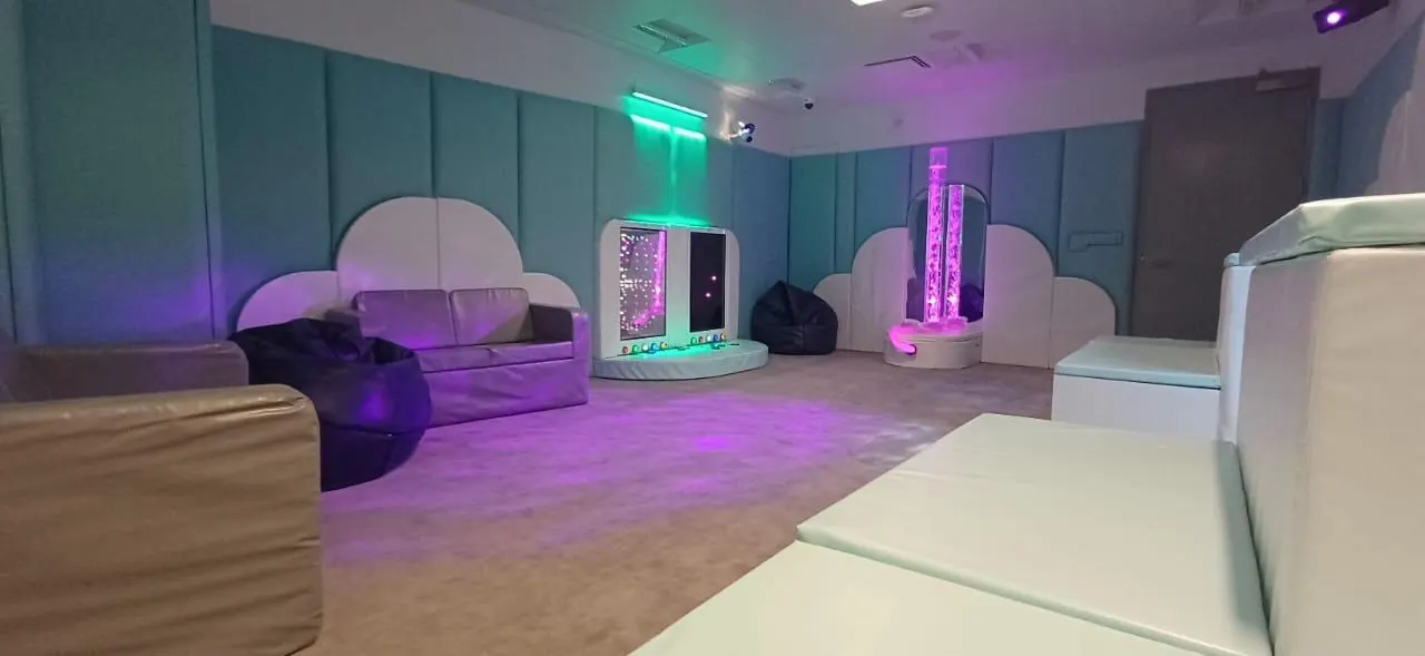 Sensory room with padded walls and interactive panels